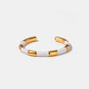 Brazalete de acero inoxidable chapado en oro de 18 quilates