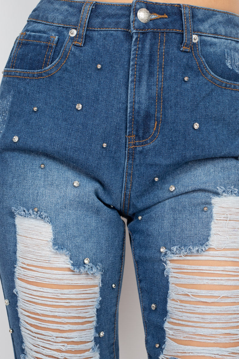 Jeans de mezclilla con frente rasgado y strass